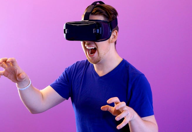 a guy wearing a virtual reality googles